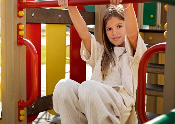 young-kid-having-fun-outdoors-playground_23-2149587774 1